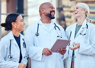 Image showing Doctor team, laughing and healthcare worker with tablet and funny joke of medical group. Diversity, technology and laugh of hospital and wellness clinic staff together with happiness and tech results