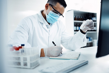 Image showing Science, research and scientist writing notes while doing a data analysis in a medical laboratory. Healthcare, notebook and male researcher working on a scientific project at a pharmaceutical lab.