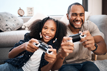 Image showing Gaming, family or children with a father and daughter in the living room of their home playing a video game together. Kids, happy or fun with a gamer dad and girl child in the house to play online