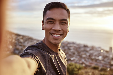 Image showing Fitness, selfie and portrait of a man on a mountain running for race, marathon or competition training. Sports, workout and happy male runner athlete taking a picture doing an outdoor cardio exercise