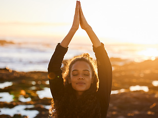 Image showing Woman, beach yoga and sunset with pray hands, eyes closed and peace of mind in summer sunshine. Girl, zen meditation and mindfulness for health, wellness and exercise by ocean with stretching outdoor