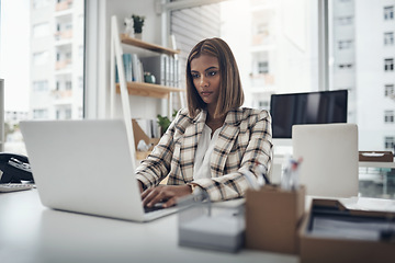 Image showing Laptop, writer and business woman typing in office workplace. Copywriting, computer and female Indian person reading, working or writing email, report or proposal, research online or planning project