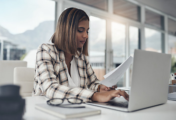 Image showing Business analyst, laptop and woman typing paperwork in office workplace. Documents analysis, computer and female person reading, working and analyzing data, graphs or charts for finance statistics.