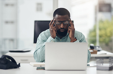 Image showing Thinking, stress and business man on laptop with headache, brain fog and mental health risk for information technology. Anxiety, fatigue or tired african person on computer problem, fail or burnout