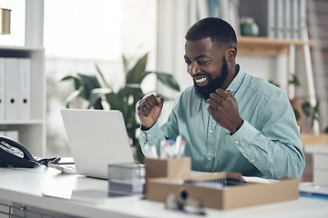 Image showing Black man, success and laptop to celebrate business profit, win or achievement in a modern office. African male entrepreneur at a desk with motivation and technology for bonus, victory and promotion