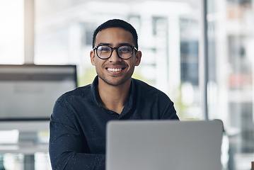 Image showing Portrait, laptop and a professional journalist man at work in an editing agency for news reporting. Computer, smile and online content with a happy male editor working in a modern journalism office