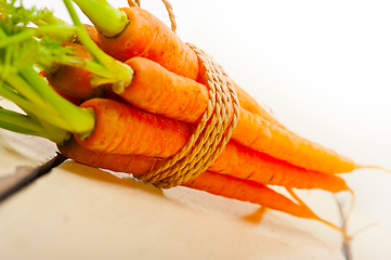 Image showing baby carrots bunch tied with rope