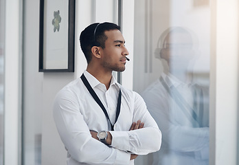 Image showing Thinking, business and man with arms crossed, window and decision with choice, opportunity and headphones. Male person, employee or agent with thoughts, ideas or tech support with professional career