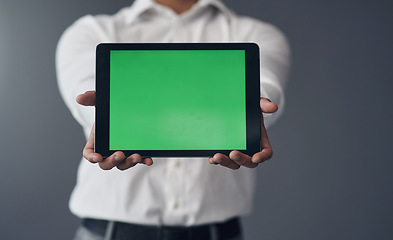 Image showing Green screen, tablet and business man hands for advertising, space and website design isolated on studio background. Professional person on digital technology mockup for career marketing and internet