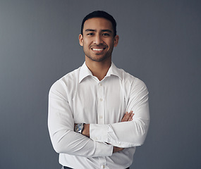 Image showing Portrait, business and Asian man with arms crossed, career and confident guy against a studio background. Face, male person and employee with happiness, startup success and professional with a smile