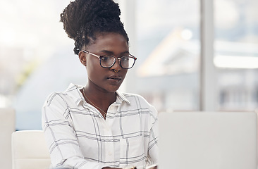 Image showing Laptop, seo and focus with a black woman editor working in her office for online content or digital logistics. Computer, editing and feedback review with a young female journalist at work on a report