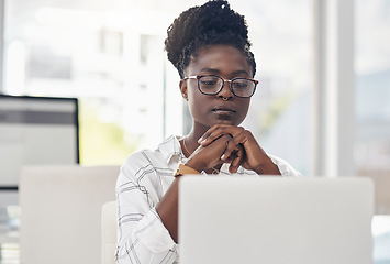 Image showing Thinking, focus and african woman on laptop for solution, research and serious job decision or planning. Reading, review and choice of person or business analyst on computer for data problem solving