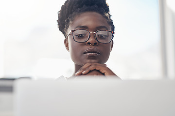 Image showing Thinking, planning and business woman on computer for solution, research and serious, focus or job decision. Reading, review and choice of african person or analyst on laptop for data problem solving