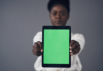 Image showing Green screen, tablet and woman in portrait isolated on a studio background for advertising space or mockup. Online mock up, website design and african person with digital technology and application