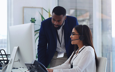 Image showing Black man, call center and woman with coaching by computer, office and learning in tech support. African male crm, mentor and teaching for telemarketing, training and customer service at help desk