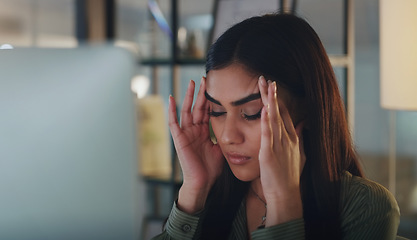 Image showing Business woman, headache and computer at night in office with anxiety, stress or crisis. Female entrepreneur at a desk with tech while tired or depressed about deadline, mistake or internet problem