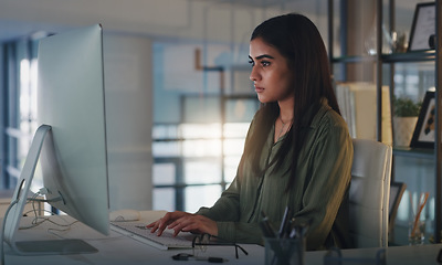 Image showing Computer, night and focus with a woman editor working in her office for a journalism or news report. Typing, editing and reporting with a young journalist at work on a desktop for online content