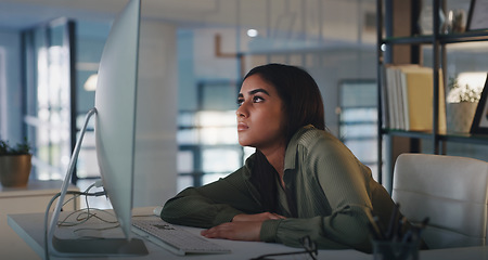 Image showing Business woman, bored and computer work at night while reading online data and info at desk. Tired, burnout and young female employee feeling fatigue from web deadline and internet research project