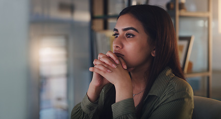 Image showing Business woman, thinking and computer at night in office with anxiety, stress or crisis. Female entrepreneur at desk with tech while tired or worried about deadline, mistake or mental health problem