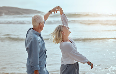 Image showing Sea, dancing and senior couple on vacation with summer love, bonding and travel dun. Dance, outdoor and elderly people with freedom by the ocean and beach by waves on holiday in Greece together