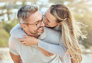 Image showing Hug, love and couple with a smile, beach or romance with relationship, marriage or summer vacation. Romantic, mature man or woman embrace, seaside holiday or bonding with happiness or loving together