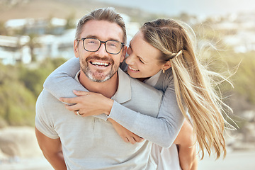 Image showing Beach, piggy back and couple with love, relationship and happiness with romantic holiday, weekend trip and marriage. Portrait, mature man and woman with a smile, hug and seaside vacation with romance