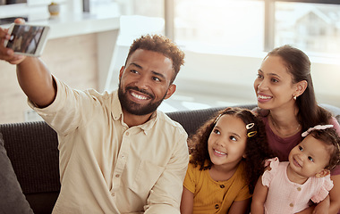 Image showing Parents, girl children and selfie on sofa with happiness, love and bonding for social media app in family home. Father, mother and daughters with photography, profile picture or together for web blog