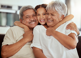 Image showing Home, grandparents hug portrait and family with child and happiness on a living room couch. Fun, smile and happy bonding with childcare, love and kid together with a young girl on a house sofa