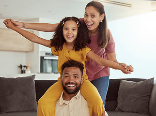 Image showing Mom, daughter and dad in home with plane game, portrait and smile together with bonding, love and happiness. Parents, happy kid and airplane games in family house with care, playing and living room