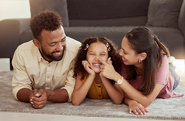 Image showing Family home, playing and kid with mom care, dad and young girl together with fun. Living room, mother and father with a child by sofa with love, bonding and parent support with a smile in lounge