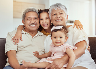 Image showing Portrait, grandparents hug and family with children and happiness on a living room . Fun, baby smile and bonding with childcare, love and kids together with a young girl and newborn on a home sofa