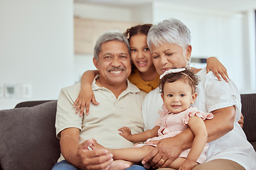 Image showing Home, grandparents hug and family with children and happiness on a living room couch. Fun, baby smile and bonding with childcare, love and kids together with a young girl and newborn on a house sofa