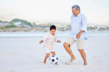 Image showing Beach, soccer and grandfather playing with child on vacation or holiday happy for sand football or sports. Travel, summer and elderly man kicking a ball with kid at the sea or ocean together