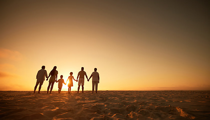 Image showing Family, holding hands beach at sunset and generations, grandparents travel with parents and kids with orange sky. Back, unity and men, women and children, silhouette and vacation with mockup space