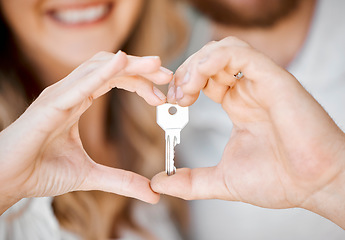 Image showing New home, couple and hand heart showing key for moving, love and mortgage celebration. Happiness, emoji and excited hands sign with house and real estate keys together with loving support and joy