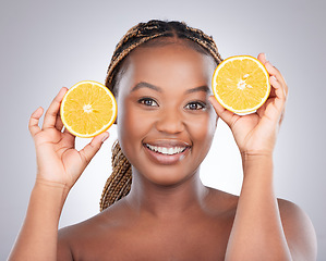 Image showing Beauty, orange and portrait of black woman in studio for natural, cosmetics and vitamin c. Nutrition, diet and detox with face of female model on grey background for citrus fruit and health product