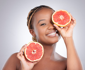 Image showing Beauty, grapefruit and portrait of black woman in studio for natural, cosmetics and vitamin c. Nutrition, diet and detox with female model on grey background for citrus fruit and health product