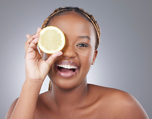 Image showing Beauty, lemon and smile with portrait of with black woman in studio for natural, cosmetics and vitamin c. Nutrition, diet and detox with model on grey background for citrus fruit and health product