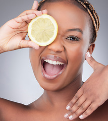 Image showing Beauty, lemon and portrait with black woman in studio for natural, cosmetics and vitamin c. Nutrition, diet and detox with face of female model on grey background for citrus fruit and health product