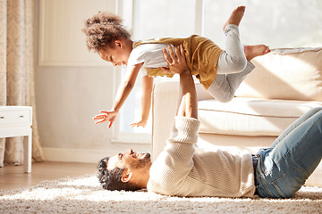 Image showing Dad, lying and floor with girl, airplane and happiness with playing games, smile or bonding in lounge. Father, daughter and game with care, love and together with plane, quality time and living room