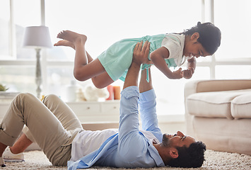 Image showing Airplane, game and father with girl on a floor with love, fun and playing in their home together. Happy, flying and child with parent in living room for bonding, relax and enjoying weekend in lounge