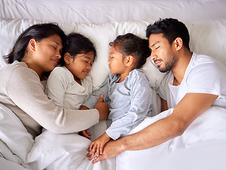 Image showing Relax, love and family sleeping in a bed from above, peaceful and dreaming in their home. Sleep, peace and top view of children with parents in a bedroom, tired and resting together on the weekend