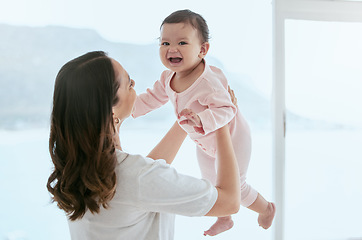 Image showing Baby laugh, portrait and mom in a home with newborn, care and parent love together with fun. Face, family and young child with mother back in a living room in house with mama and childcare in lounge