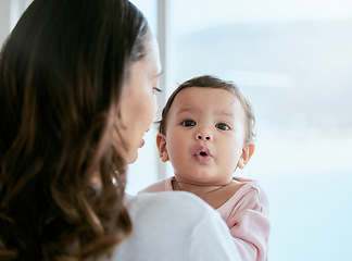 Image showing Baby, portrait and mom in a home with newborn, care and parent love together feeling curious. Face, family and young child with mother back in a living room in house with mama and childcare in lounge