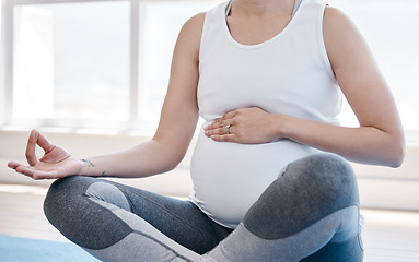 Image showing Woman, pregnancy yoga and lotus on floor for health, exercise and wellness for body, mind and peace. Girl, pregnant and pilates with zen meditation, mindfulness and relax in gym, studio or house