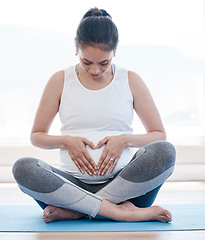 Image showing Yoga, pregnancy and hands on stomach for woman, relax or health on floor for peace, future or mindset. Girl, pregnant pilates and zen meditation for mindfulness, hope or faith in gym, studio or house