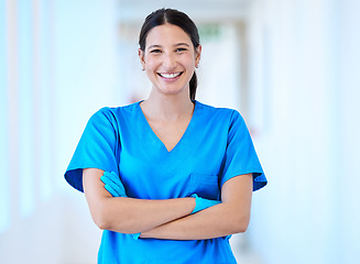 Image showing Woman, nurse and portrait with arms crossed and smile in a hospital and clinic. Employee, healthcare and wellness professional with happiness and confidence from doctor and medical work and care