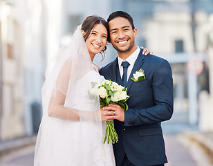 Image showing Portrait, bride and groom at wedding in city outdoors happy to start a happy marriage journey together. Smile, save the date and married couple holding a bouquet of flowers at a love celebration