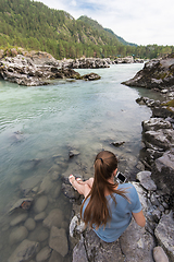 Image showing Woman resting at river