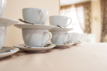 Image showing Many cups on table,